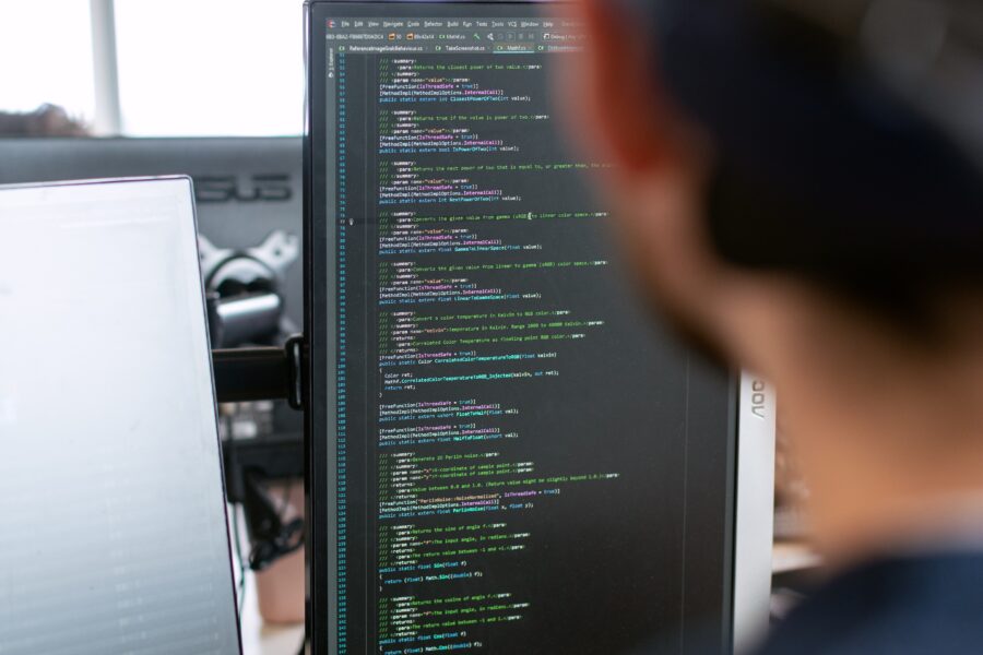 Tag Management professional looking at a laptop